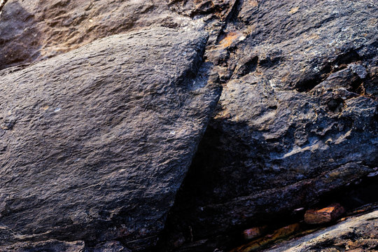 Natural black rock textured backround.