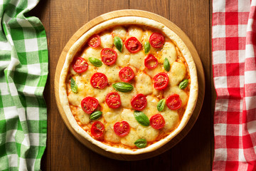 pizza at wooden table