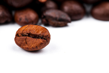 Frame of roasted coffee beans isolated on white