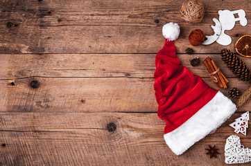 Obraz na płótnie Canvas Cup of coffee and Santas hat, Christmas set, gift and Christmas