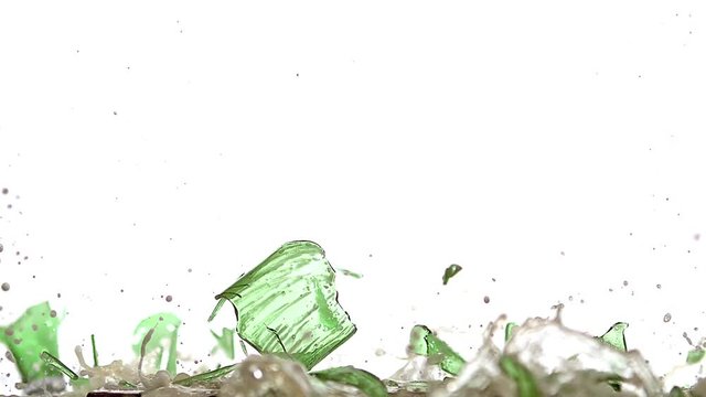 Bottle of Beer falling, Breaking and Splashing on Steel Plate against White Background, Slow motion