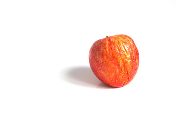 Wizen apple presented as old aging skin