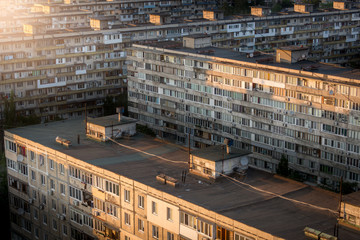 Panoramic view of buildings in neighborhood at sunset
