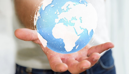 Businessman holding digital tactile world ‘3D rendering’