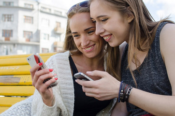 Two girlfiends with the telephones 
