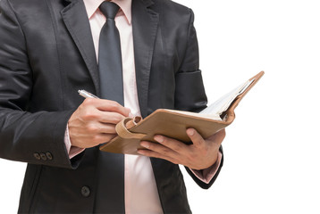 Businessman writing the note book on white background