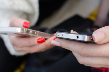 Young woman is using her cellphone 
