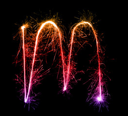 Sparkler firework light alphabet m (Small Letters) at night