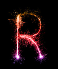 Sparkler firework light alphabet R (Capital Letters) at night