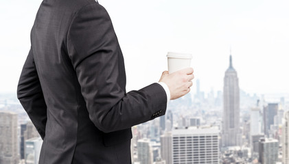 Side view of businessman against New York view