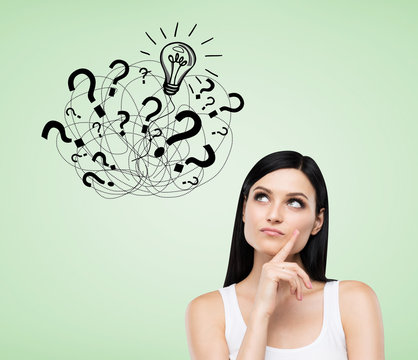 Girl with question marks on green background - Powered by Adobe