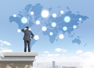 Businessman scratching head and looking at sketch in the sky