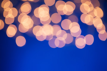 Lights: Defocused Christmas Lights Against Blue Colored Backgrou