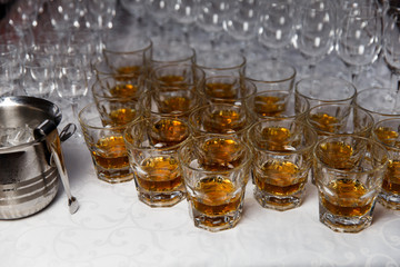 Glasses with an alcoholic drink on buffet table