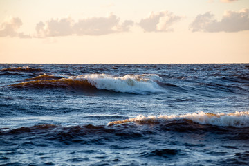 comfortable beach of the baltic sea with water crashing on the r