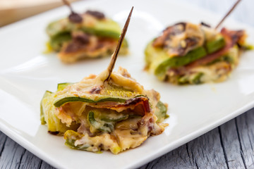 Zucchini and bacon rolls baked