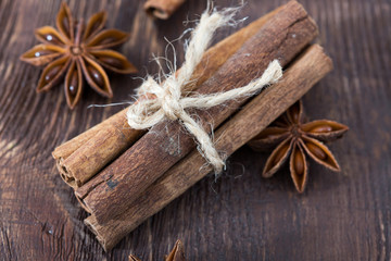 cinnamon and star anise on a wooden background . close-up