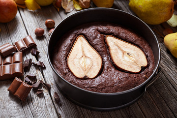 Chocolate pie with pear autumn homemade traditional American holiday baked pastry dessert gourmet food on vintage wooden background table