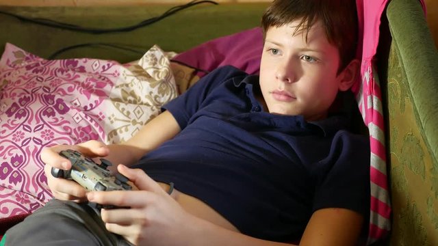 Boy playing game joystick video online game console