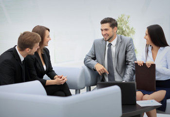 Happy business people talking on meeting at office