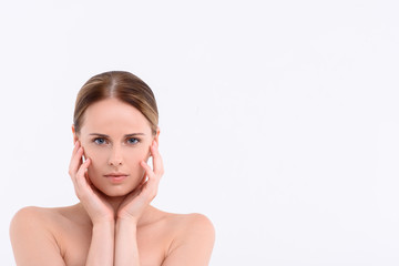 Sensual girl enjoying facial skincare treatment