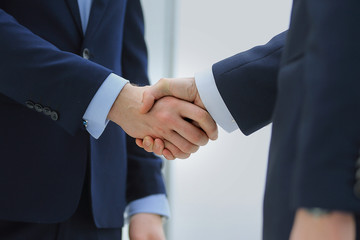 handshake of two businessmen in office