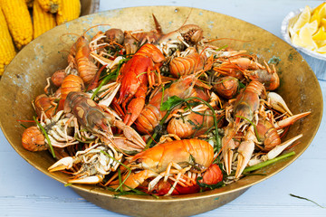Crayfish in big old brass pot
