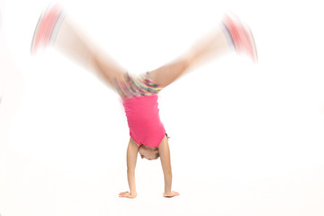 Girl doing a cartwheel at high speed.