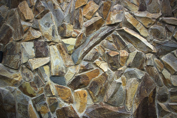 wall of granite boulders of different colors