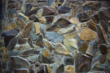wall of granite boulders of different colors