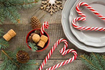 Christmas decoration with candy canes on wooden background. Holidays background.