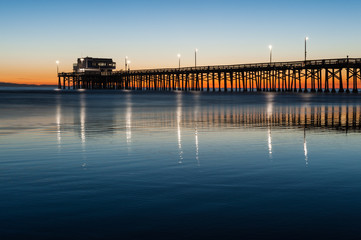 Fototapeta na wymiar Newport beach pier silhouette sunset
