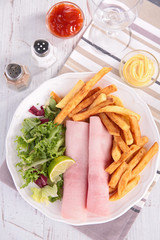 slice of ham with french fries