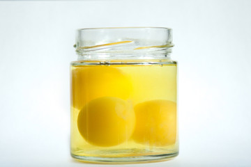 Egg yolks in glass jar.