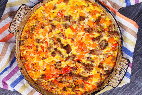 Butternut Squash And Sausage Frittata. Pumpkin, Meat, Red Pepper And Egg Casserole. View From Above, Top Studio Shot