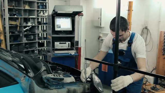 Man adjusts the meter for the hood.