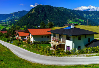 Beautiful alpine summer landscape. Mountains and sun, blue sky,