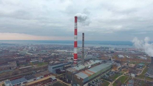 Aerial view of power plants, thermal power station. Smoking pipe at industrial area. 4K.