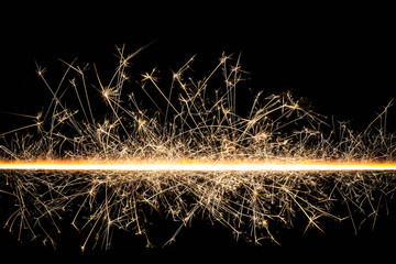 New years eve line sparks background.