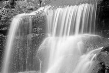 Beautiful waterfall in forest landscape long exposure flowing th