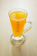 orange juice on wood background