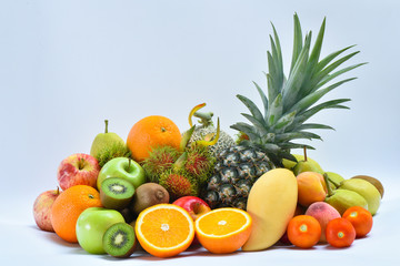 Group of fresh fruits and vegetables on white background