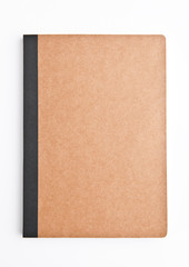 Brown note book empty and blank on white