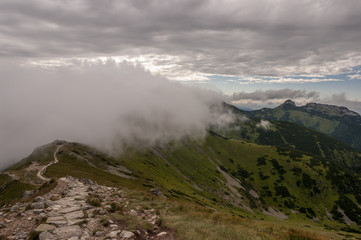 Amazing view of the mountain ridge under the clouds