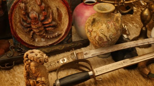 Pile of different antiques from many epochs dolly shot