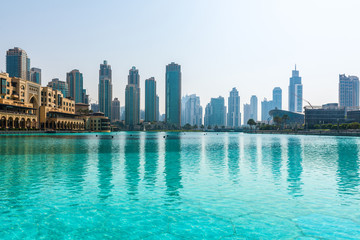 Skyline view of Dubai, UAE, reflected in a pool