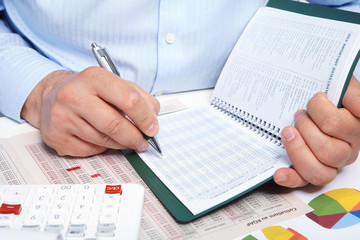 Businessman with notebook in the office