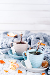 Obraz na płótnie Canvas Traditional winter beverage tea with mint and tangerine.