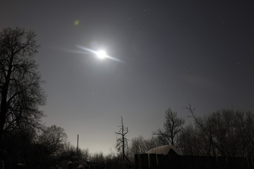 Night and small village in winter snow