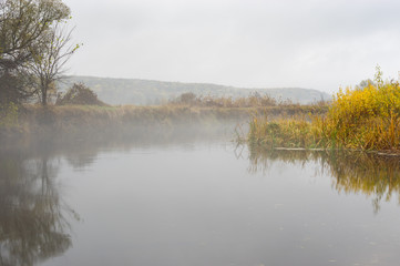 Autumnal landscape with foggy Vorskla river at autumnal season in Sumskaya oblast, Ukraine
